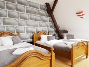 Postel nebo postele na pokoji v ubytování Hotel Camelot