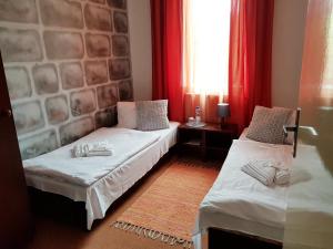 Postel nebo postele na pokoji v ubytování Hotel Camelot