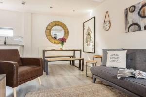 a living room with a couch and a table at Host & Stay - Slater Street Apartments in Liverpool