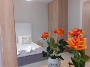 A bed or beds in a room at Nini's House 2 - 100m from beach NIDRI TOWN CENTER