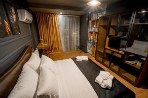 A bed or beds in a room at The Kayseri Loft Hotel