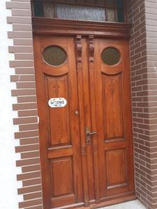 a wooden door with a sticker on it at Villa Kaszubska in Ustka