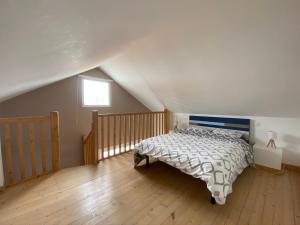 a bedroom with a bed in a attic at CENTRE CHATELAILLON GRAND LOFT ** 100m DE LA PLAGE in Châtelaillon-Plage