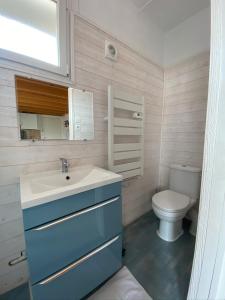 a bathroom with a sink and a toilet at CENTRE CHATELAILLON GRAND LOFT ** 100m DE LA PLAGE in Châtelaillon-Plage +11 photos