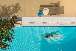 a swimming pool with a shark in the water at Rodos Park in Rhodes Town