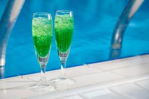 two champagne glasses sitting on top of a tub at Rodos Park in Rhodes Town