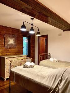 Katil atau katil-katil dalam bilik di Pensiunea Lac