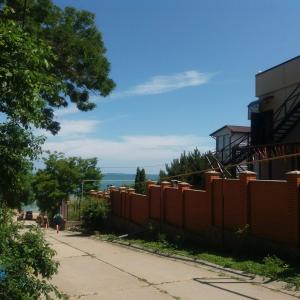 a fence on the side of a sidewalk next to a street at Caramel' in Chornomorsk