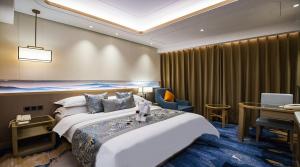 Tempat tidur dalam kamar di Kunming Golden Spring Hotel