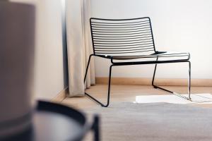 a chair sitting in the corner of a room at Hotel 171 in Rotterdam