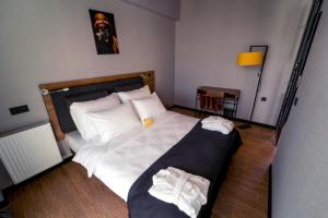 A bed or beds in a room at The Kayseri Loft Hotel