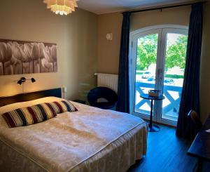 Postel nebo postele na pokoji v ubytování Taastrup Park Hotel + 37 fotografií