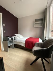 Ένα ή περισσότερα κρεβάτια σε δωμάτιο στο Hotel New Regina