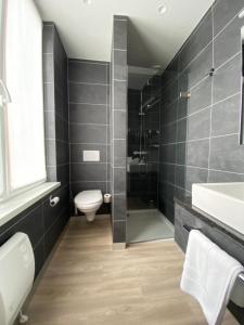 Koupelna v ubytování Hotel New Regina + 37 fotografií