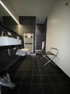 Ένα μπάνιο στο Hotel New Regina