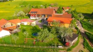 an aerial view of a house with a playground at Ferienwohnungen Berger in Scheidegg