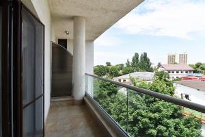 a balcony with a view of a city at Hotel Bella Vista in Eforie Nord