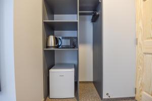 a walk in pantry with a washer and dryer at Palanga Centrum in Palanga