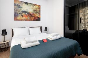 Кровать или кровати в номере Varsovia Comfort