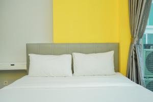 Ένα ή περισσότερα κρεβάτια σε δωμάτιο στο Highest Value 1BR Apartment at Tree Park City BSD By Travelio +9 φωτογραφίες