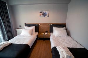 A bed or beds in a room at The Kayseri Loft Hotel