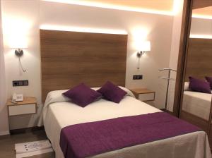 Postel nebo postele na pokoji v ubytování Hotel La Noyesa *** Superior
