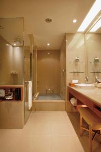 
a bathroom with a sink, toilet, and bathtub at San Want Residences Taipei in Taipei
