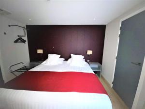 Ένα ή περισσότερα κρεβάτια σε δωμάτιο στο Hotel New Regina