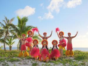 a group of people in costume on the beach at Crowne Plaza Resort Saipan in Garapan