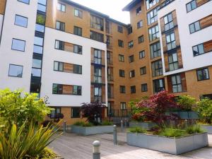 an apartment building with plants in front of it at The Class Place in Birmingham