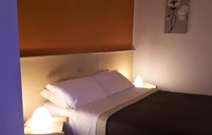 Postel nebo postele na pokoji v ubytování Hotel Kristall