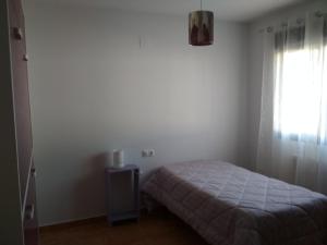 A bed or beds in a room at Casa Rural La Galana Albacete