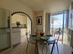 a kitchen and dining room with a table and chairs at House La Baia delle Favole by Holiday World in Sestri Levante