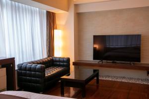 HOTEL APERTO (Adult Only)的电视和/或娱乐中心