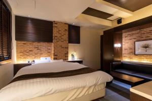 HOTEL APERTO (Adult Only)客房内的一张或多张床位