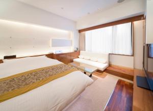 HOTEL APERTO (Adult Only)客房内的一张或多张床位
