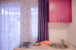 a kitchen counter with a sink and a window at Mediterranean Retreat Becici in Becici +37 photos
