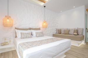 Postel nebo postele na pokoji v ubytování Naxian Spirit Inn