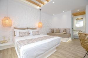 Postel nebo postele na pokoji v ubytování Naxian Spirit Inn