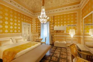 Posteľ alebo postele v izbe v ubytovaní Palazzo Marletta Luxury House Hotel