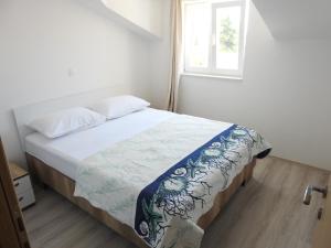 Posteľ alebo postele v izbe v ubytovaní Apartmani Hrvoje Klarić - Srima