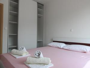 Posteľ alebo postele v izbe v ubytovaní Apartmani Hrvoje Klarić - Srima