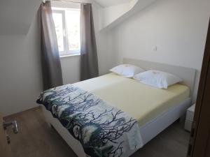 Posteľ alebo postele v izbe v ubytovaní Apartmani Hrvoje Klarić - Srima