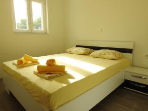 Posteľ alebo postele v izbe v ubytovaní Apartmani Hrvoje Klarić - Srima