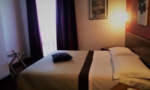 Postel nebo postele na pokoji v ubytování Hotel Kristall