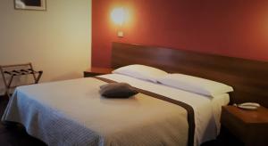 Postel nebo postele na pokoji v ubytování Hotel Kristall