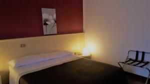 Postel nebo postele na pokoji v ubytování Hotel Kristall