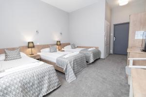 Postel nebo postele na pokoji v ubytování Hotel Jan Sander