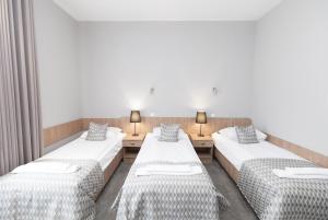 Postel nebo postele na pokoji v ubytování Hotel Jan Sander