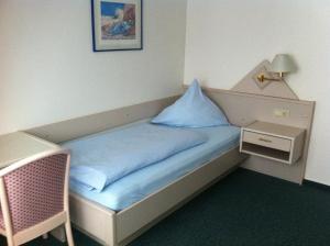 Cama o camas de una habitación en Hotel Am Stadthaus Garni